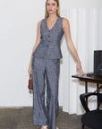 Sleeveless button-down vest featuring a v-neckline